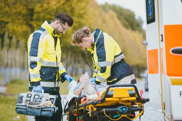 depositphotos_236060016-stock-photo-emergency-doctor-giving-oxygen-to